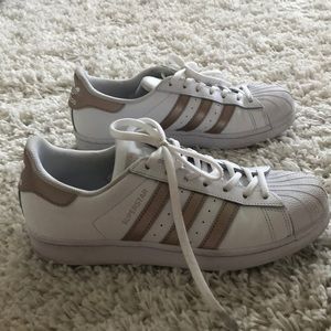 White and rose gold adidas shoes
